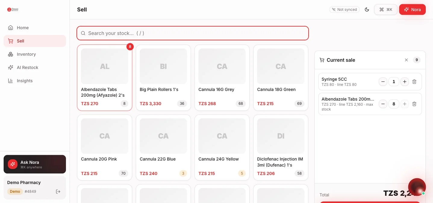 Development interface showing a product catalogue, quantities, TZS prices, and a reviewable sales basket using demo pharmacy data